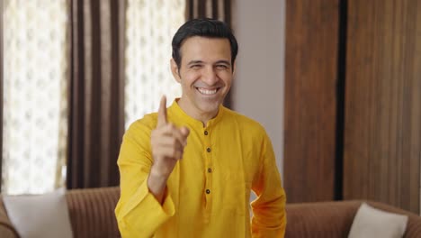 Happy-middle-aged-Indian-man-laughing