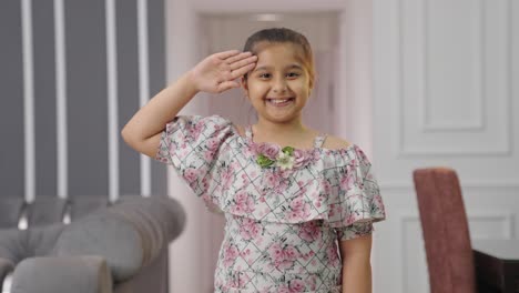 Happy-and-proud-Indian-kid-girl-saluting