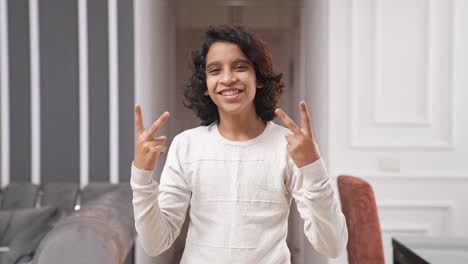 Indian-kid-boy-showing-victory-sign