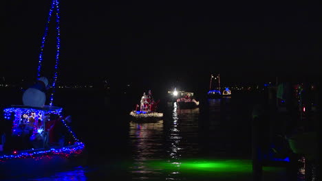 A-holiday-parade-of-boats-makes-its-way-through-a-harbor-in-Florida