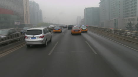 Taxis-and-vehicles-travel-along-busy-roads-in-China