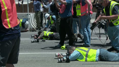 Onlookers-watch-and-document-as-heavy-equipment-tears-down-part-of-a-bridge-over-the-405-freeway-in-Los-Angles