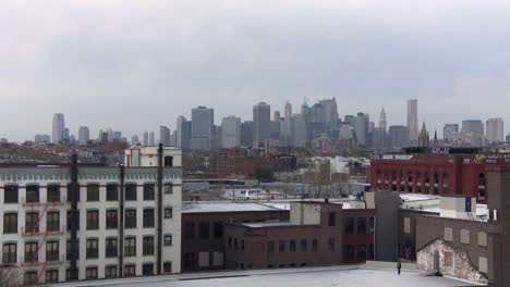 The-Manhattan-skyline-as-seen-from-a-rooftop-in-Brooklyn