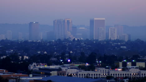 A-time-lapse-night-to-day-zoom-back-shot-of-Los-Angeles-downtown-skyline-California