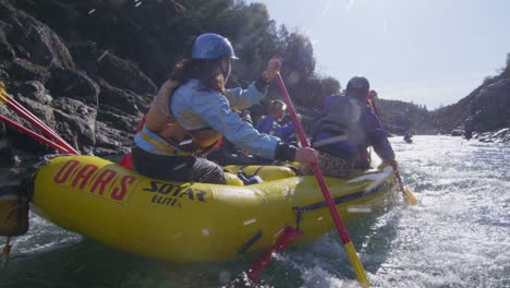 Rafters-paddle-and-negotiate-rapids-on-a-fast-flowing-river
