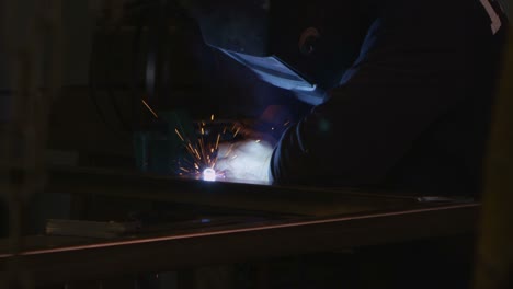 An-arc-welder-welds-in-a-workshop-1