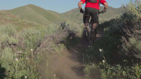 A-mountain-biker-races-through-a-rocky-area-at-high-speed-1