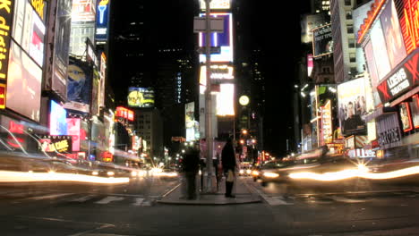 Shot-slowly-pans-right-in-an-accelerated-shot-of-traffic-and-pedestrians-in-New-York's-Times-Square