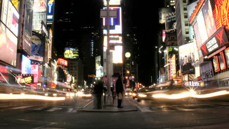 A-slow-left-pan-of-an-accelerated-shot-of-traffic-and-pedestrians-in-New-York's-Times-Square