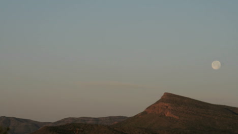 Time-lapse-shot-of-the-moon-setting-over-the-Texas-hills