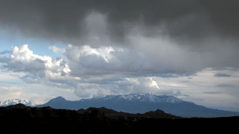 Storm-clouds-gather-over-Goblin-Valley-State-Park-amidst-flashes-of-sunlight