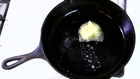 A-Tab-Of-Margarine-Containing-Trans-Fats-Melts-In-A-Hot-Skillet-1