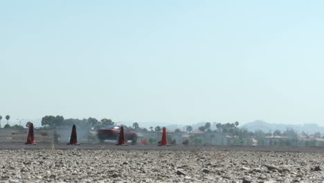 Low-Shot-Of-A-Red-Car-As-It-Smokes-Its-Tires-Through-A-Drifting-Course-At-Camarillo-Airport-In-Camarillo-California