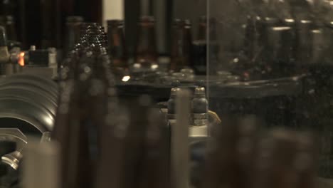 Bottles-Zip-Along-A-Conveyor-Belt-In-A-Bottling-Plant-4