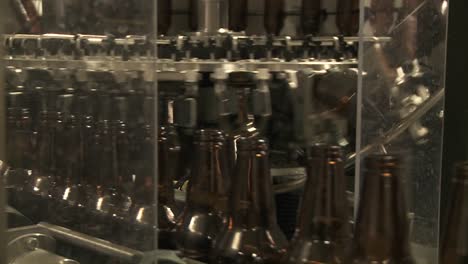 Bottles-Zip-Along-A-Conveyor-Belt-In-A-Bottling-Plant-7
