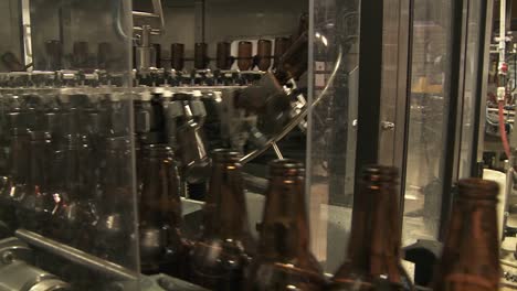 Bottles-Zip-Along-A-Conveyor-Belt-In-A-Bottling-Plant-8