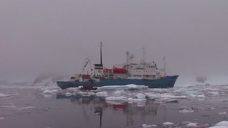 An-oceanic-research-vessel-floats-amongst-icebergs-in-Antarctica