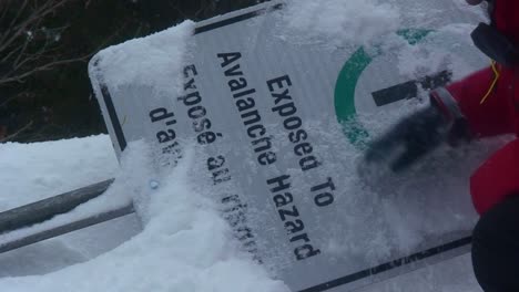 A-sign-warning-of-avalanches-is-buried-under-an-avalanche