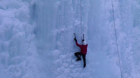 A-man-climbing-a-frozen-waterfall