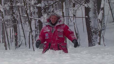 A-weatherman-or-reporter-struggles-through-deep-snow-drifts