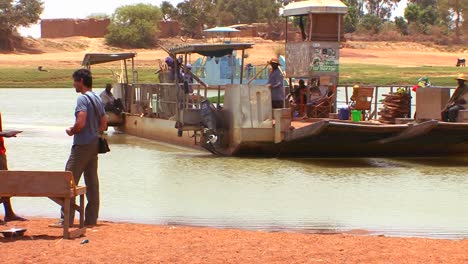 A-ferry-boat-crosses-a-river-in-Mali-Africa