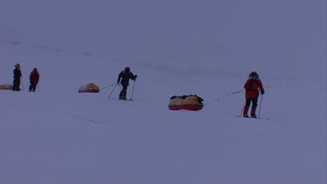 An-Arctic-expedition-moves-across-frozen-tundra-on-cross-country-skis-towing-supplies-1