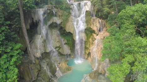 Aerial-over-a-small-tropical-waterfall-in-a-jungle-setting