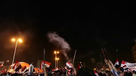 Fireworks-go-off-above-protestors-gathered-in-Tahrir-Square-in-Cairo-Egypt
