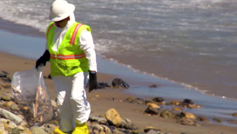 Workers-Clean-Up-After-The-Massive-Beach-Cleanup-Effort-Following-The-Refugio-Oil-Spill-In-Santa-Barbara-1