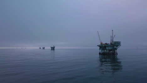 Moody-And-Mystical-Aerial-Shot-Of-Oil-Derricks-And-Platforms-Off-The-Coast-Of-Santa-Barbara-In-The-Channel-Islands