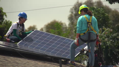 Workers-Install-Solar-Panels-On-The-Roof-Of-A-Middle-Class-House-6