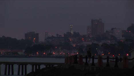 A-Jogger-Has-An-Extraordinary-Nighttime-View-Of-San-Francisco-With-Its-Famous-Landmarks-Etched-Against-The-Sky