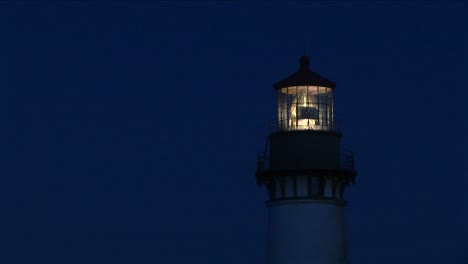 A-Closeup-Of-The-Beacon-At-Top-Of-Lighthouse-Tower-At-Night