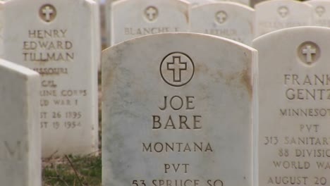 A-Closeup-Tracking-Shot-Of-The-Inscriptions-For-Both-Men-And-Women-Buried-In-Arlington-National-Cemetery