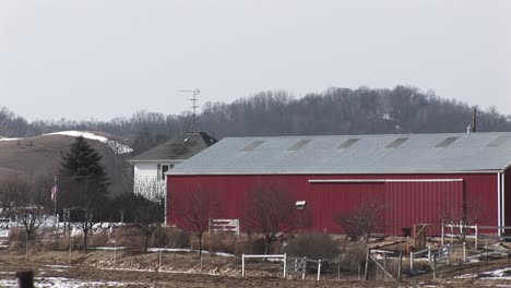 The-Camera-Pans-An-American-Farm-With-Red-Barns-And-Silos