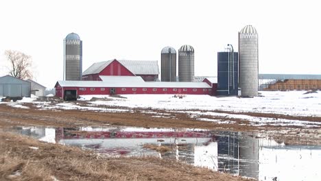 Longshot-Of-Farm-Barns-And-Silos-On-A-Winter'S-Day