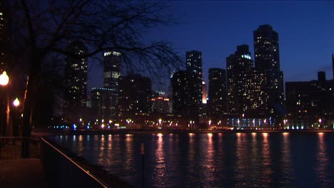 The-Chicago-Skyline-After-Dark-With-Lights-Reflected-In-Lake-Michigan