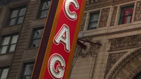 The-Camera-Pans-Down-The-Chicago-Theater'S-Colorful-Marquee