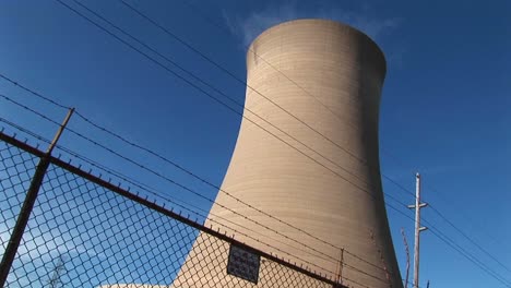 A-Nuclear-Power-Plant-Is-Protected-By-A-High-Cyclone-Fence-And-Barbedwire