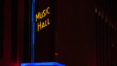 The-Camera-Pans-Up-The-Neon-Illuminated-Radio-City-Music-Hall-Marquee-At-Night