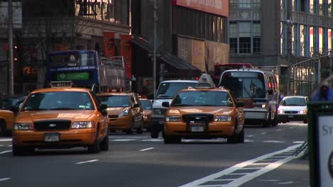 A-Brave-Bicyclist-And-Pedestrian-Deal-With-Heavy-Traffic-On-A-Busy-Oneway-Street