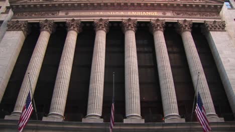 A-Wormseye-View-Of-The-Exterior-Of-The-Stock-Exchange-Building-Focuses-On-Its-Corinthian-Columns-And-Decorative-Frieze-Above