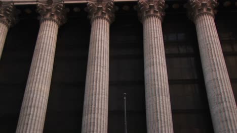 The-Camera-Pans-Up-The-Columns-Of-The-New-York-Stock-Exchange-Building-To-The-Inscription-And-Frieze-At-The-Top