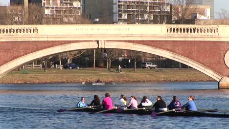 A-Women'S-Rowing-Team-Crosses-The-Charles-River-During-Practice