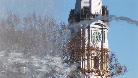 An-Artistic-Shot-Of-The-City-Hall-Tower-Through-Fountain-Spray-In-Center-City-Philadelphia