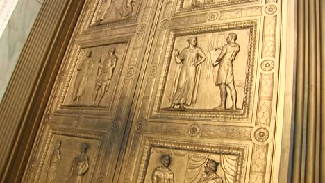 Close-View-Panup-Of-The-Bronze-Sculptures-On-The-West-Entrance-Doors-Of-The-Supreme-Court