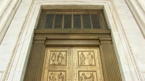 View-Of-Columns-And-Lamp-Above-Bronze-Doors-At-The-West-Entrance-Of-The-Supreme-Court