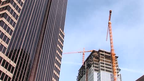 A-Tilt-Shot-Of-A-Skyscraper-And-New-Construction-In-The-City-Of-Atlanta