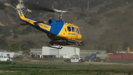 A-County-Fire-Fighting-Helicopter-Lands-In-A-Field