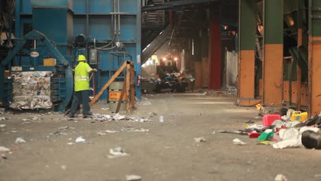 A-skip-loader-moves-pallets-of-recycled-materials-in-a-factory-1